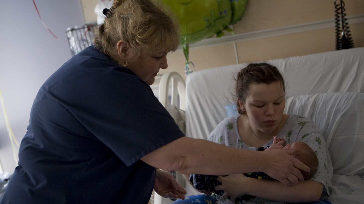 Nurse, new mom and baby.