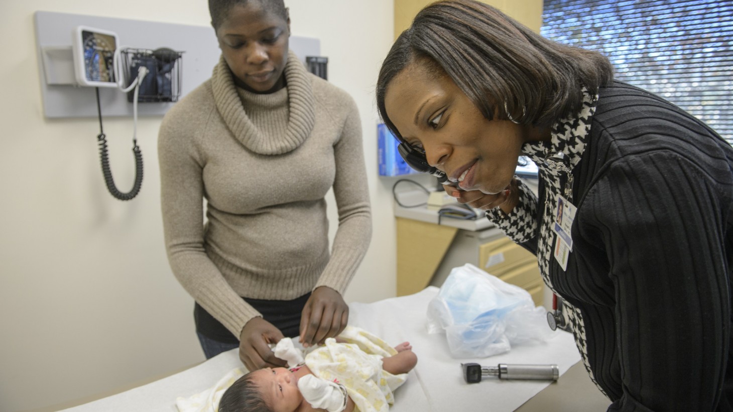 Shantia Moss (mother) with Lena Alexandra Gillett (child) and Southwood Pediatrics Lead MD/Co-Lead Reneathia P. Baker.