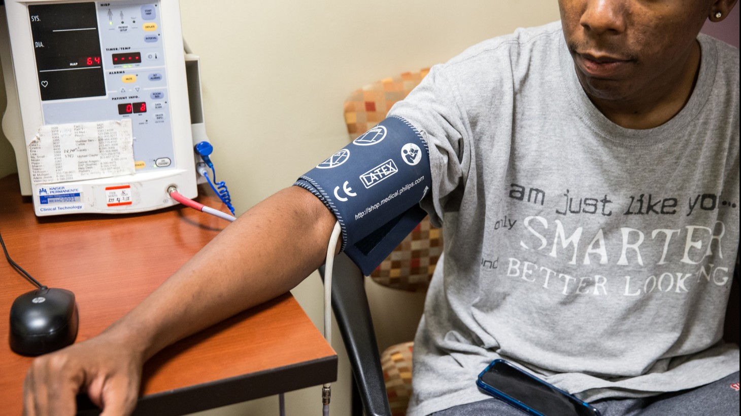 Young man getting his blood pressure checked