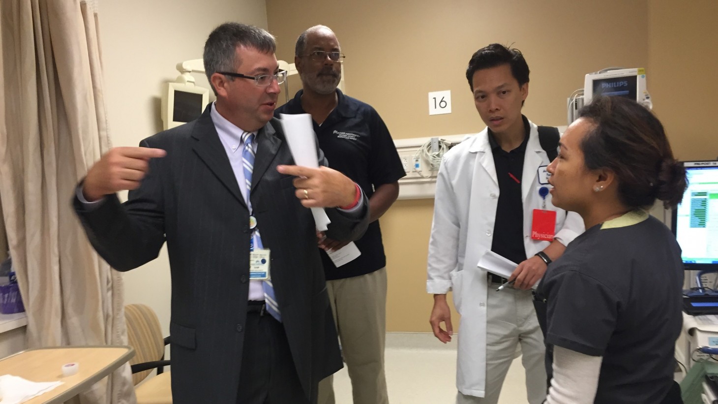 Four members of the workplace safety Tiger Team in conversation