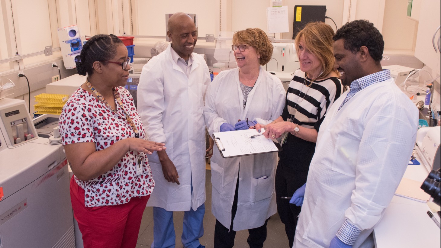 Group of health care workers reviewing a chart together 