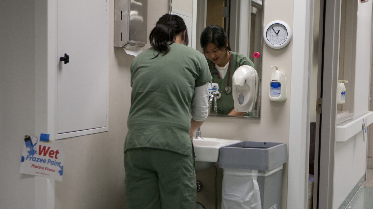 Person washing hands.