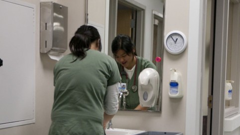 Person washing hands.